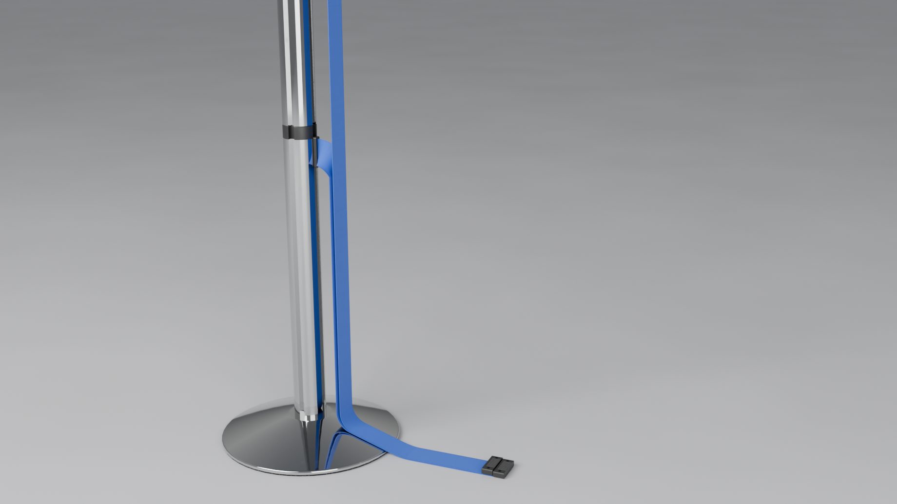 A double belt unhooked from its post: both belts hang down the tube and end on the floor